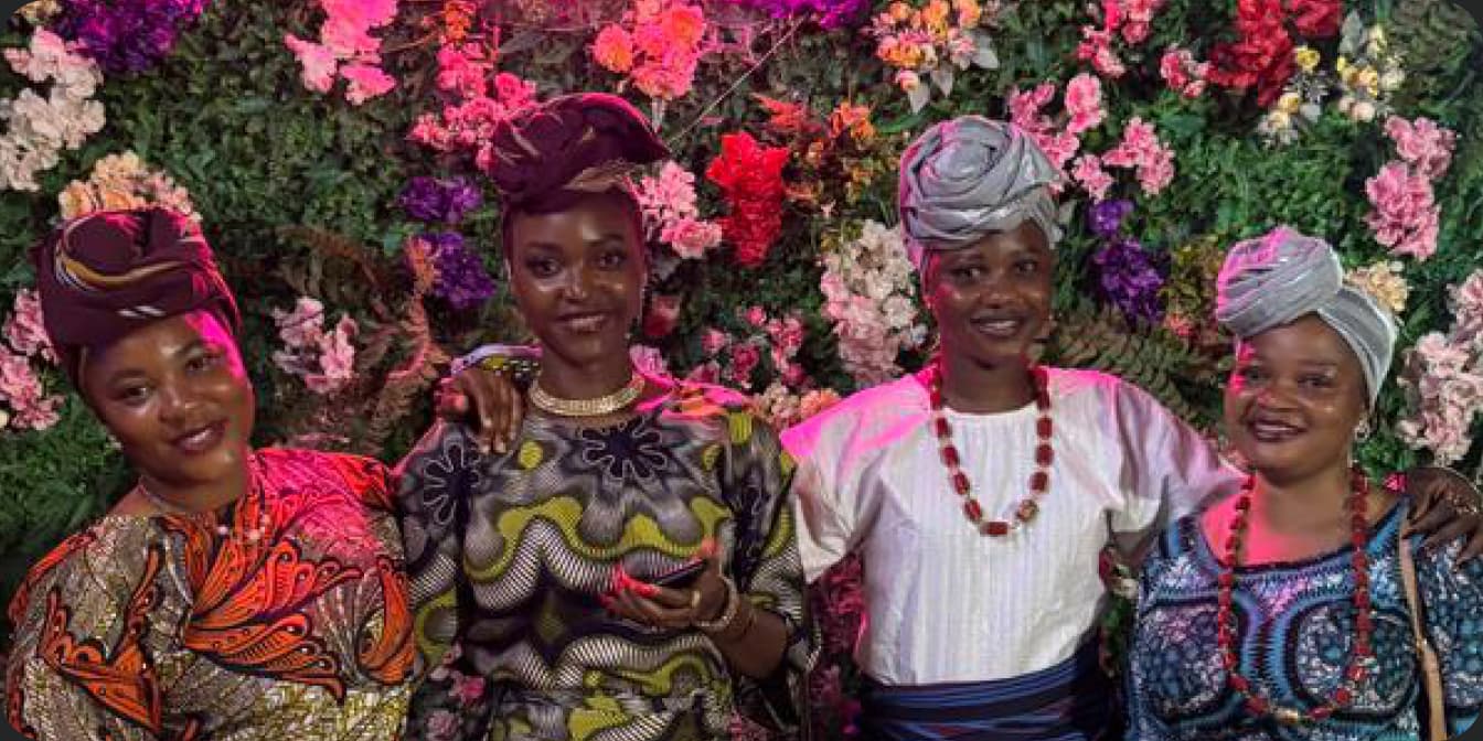 Guests in colourful Nigerian attire enjoying a celebration